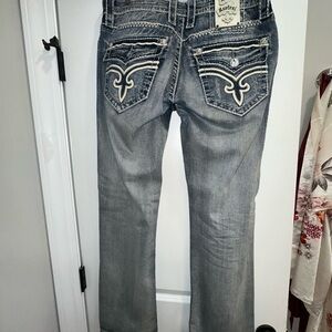 Rock Revival Blue Boot Cut Jeans with Embellished Pockets